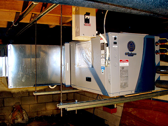 A closeup of the heat pump in the basement